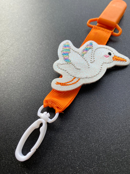 Stork rainbow wings bright orange MRI safe badge clip