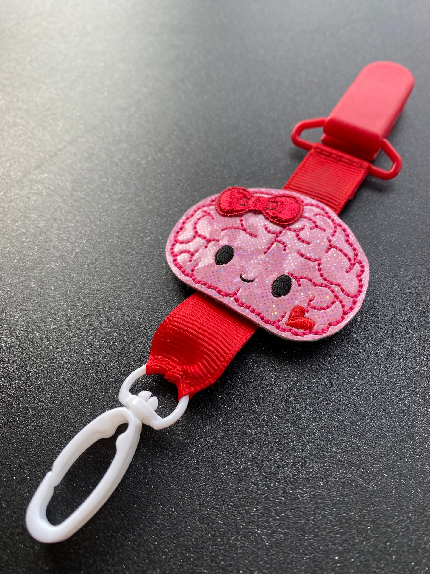 Brain buddy with bow cherry red MRI safe badge clip